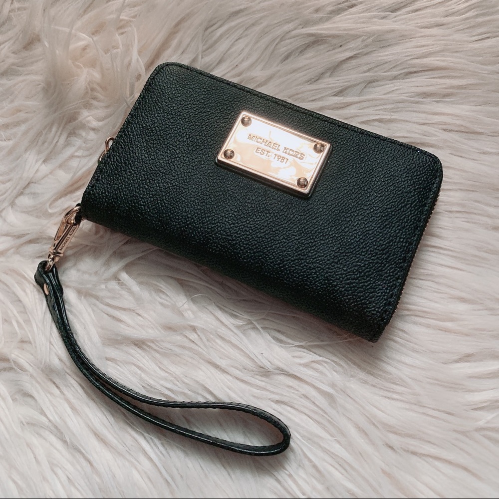 Discontinued black on black Michael Kors wristlet